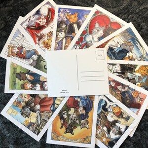 May include: A set of ten postcards featuring colorful illustrations of cats in various scenes. The postcards are blank on the back and have a space for a stamp. The text on the postcards includes "Hamlet" and "Erik Roe Morris".