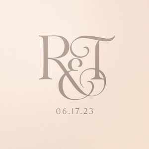 May include: A light beige background with the letters "R & T" in a stylized, elegant font. Below the letters is the date "06.17.23" in a simple, sans-serif font. The overall design is simple and classic.