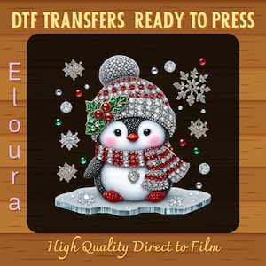 May include: A digital image featuring a cute penguin wearing a sparkling hat and scarf with red and white stripes. The penguin is adorned with crystals and holly. The image includes the text "DTF TRANSFERS READY TO PRESS" and "High Quality Direct to Film".