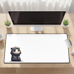 May include: A white rectangular mouse pad with a black border. A cartoon panda wearing a dark gray hooded jacket is on the left side. A computer monitor, mouse, and small potted plants are also visible.