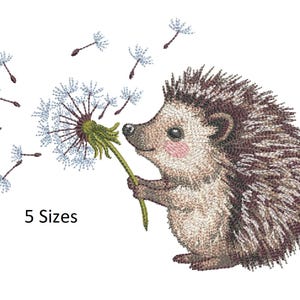 May include: An embroidered image of a hedgehog blowing on a dandelion, with several seeds floating away. The hedgehog has brown and white quills, a pink nose, and is holding the green stem of the flower. The text "5 Sizes" is below the image.