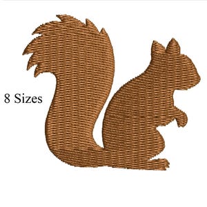 May include: A brown embroidered squirrel design with a bushy tail and the text "8 Sizes". The squirrel is depicted in a side profile, with detailed stitching creating a textured appearance. Ideal for embroidery projects.