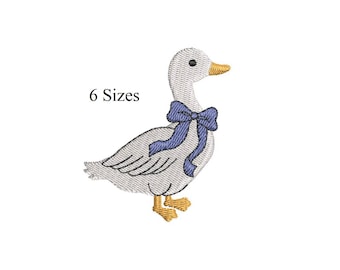 May include: An embroidered design of a white goose with a blue bow around its neck, a yellow beak, and yellow feet. The text "6 Sizes" is above the goose. This design is suitable for various embroidery projects.