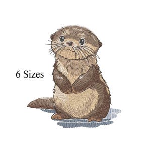 May include: An embroidered design of a cute otter in shades of brown and tan, standing upright with its paws clasped. The text "6 Sizes" is displayed to the left of the otter.