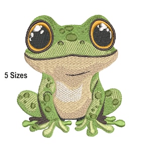 May include: An embroidered frog design in shades of green, tan, and brown. The frog has large, expressive eyes with yellow and black details. The text "5 Sizes" is visible on the left side. This design is suitable for embroidery projects.
