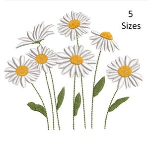 May include: Embroidered daisy design with white petals and yellow centers, green stems and leaves. The image includes the text "5 Sizes". This floral design is suitable for various craft projects.