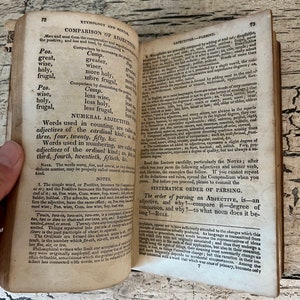May include: A page from an old book about the English language, focusing on the comparison of adjectives. The text discusses the positive, comparative, and superlative forms of adjectives, as well as the use of numerical adjectives.