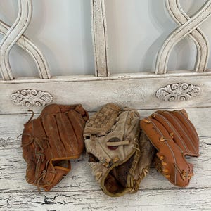 Vintage Leather Baseball Glove Pile: Rustic Sports Decor, Man Cave Display