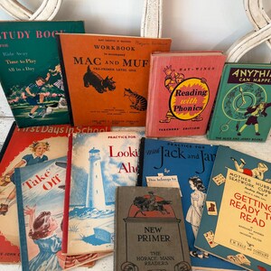 May include: A collection of ten vintage children's educational workbooks and readers featuring colorful illustrated covers with titles including Mac and Muf, Reading with Phonics, Anything Can Happen, Take Off, Looking Ahead, and Getting Ready to Read.