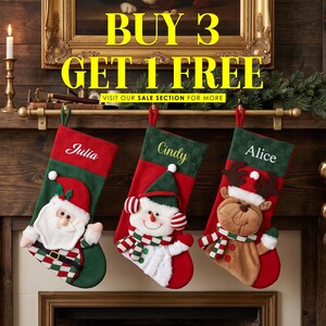 May include: Three Christmas stockings hanging on a mantel, featuring embroidered names Julia, Cindy, and Alice. The stockings display plush Santa, snowman, and reindeer characters with red and green fabric. Text reads BUY 3 GET 1 FREE.