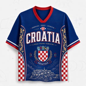 May include: A blue V-neck jersey featuring the word CROATIA in white letters, a red and white checkered shield emblem, the text DOMOVINA PONOS JEDINSTVO, LJUBAV PREMA DOMOVINI, and HRVATSKA, with a detailed illustration of a coastal town at the bottom.