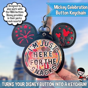 May include: Black Mickey Mouse ear keychain with the text "I'M JUST HERE FOR THE SNACKS." The keychain is designed to hold Disney buttons. The ears have red embroidered designs. The keychain is a fun accessory for Disney park visits.