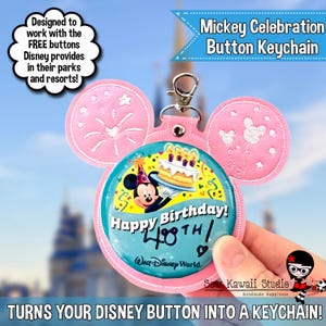 May include: A pink Mickey Mouse-shaped keychain with a button featuring Mickey Mouse holding a birthday cake. The button reads "Happy Birthday! 40th" and "Walt Disney World." The keychain is designed to hold Disney buttons.
