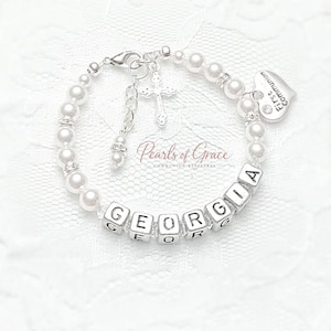 May include: A set of three ceramic mugs with a speckled, matte finish. The mugs are in shades of cream, light gray, and dark gray. Each mug has a simple, minimalist design and a rounded handle.