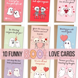 May include: A collection of nine greeting cards featuring cartoon ghosts and skeletons with romantic puns. Each card displays unique illustrations of characters with hearts, balloons, and text such as I've fallen for you, bone-afide legends, and haunting you.