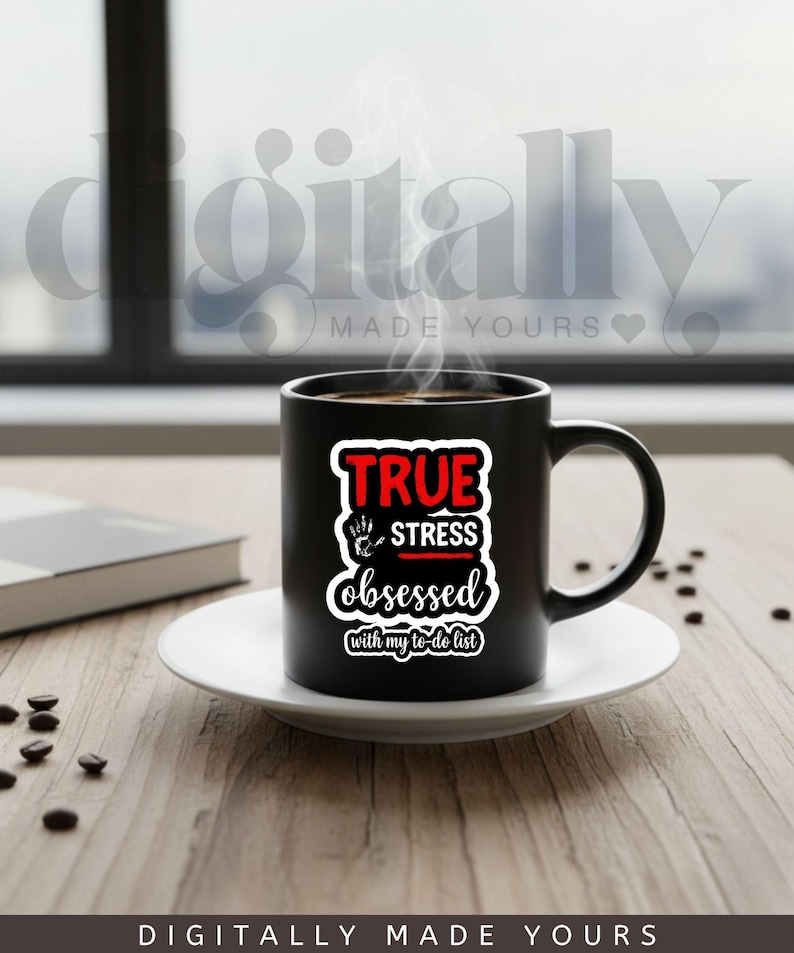 May include: A black ceramic mug with the text "TRUE STRESS obsessed with my to-do list" in red and white. The mug sits on a white saucer, with coffee beans scattered around. Steam rises from the coffee, suggesting it's hot.