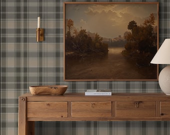 May include: A wooden console table with four drawers, a lamp, and two woven baskets. A framed landscape painting hangs above the table. The wall is covered in a green and gray plaid wallpaper. A beige rug is on the floor.