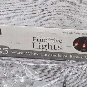 May include: Package of 35 warm white tiny lights on brown wire. The lights are pre-tested and have a safety fuse plug. The total length of the lights is 7.5 feet.