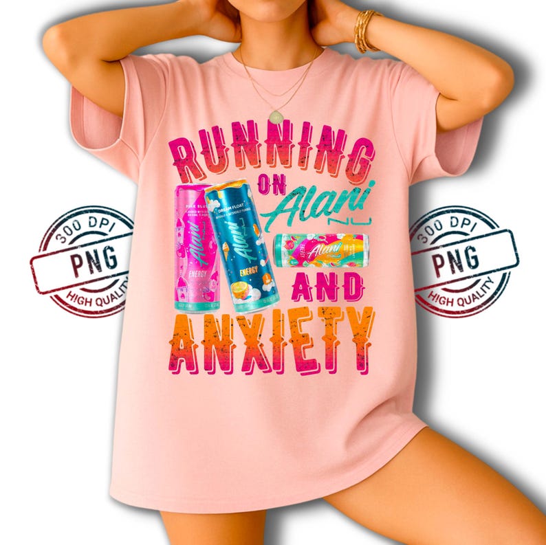 May include: A light pink t-shirt with the text "RUNNING ON Alani AND ANXIETY" in colorful letters. The shirt features three Alani Nu energy drink cans in pink, blue, and a multi-colored design.