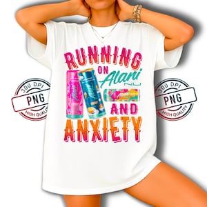 May include: White t-shirt with the text "RUNNING ON Alani AND ANXIETY" in pink, orange, and teal. The shirt features three colorful Alani Nu energy drink cans. A PNG stamp is in the upper left and right corners.
