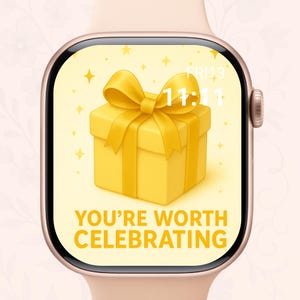 May include: A rose gold smartwatch shows a yellow gift box with a bow on the screen. The text "YOU'RE WORTH CELEBRATING" is below the gift. The time is 11:11.