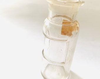 antique medicine apothecary in original empty glass jar in clear glass from 1920s