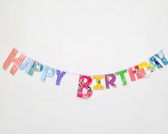 Oilcloth banner garland, birthday party, an assortment of different of types and patterned of oilcloth, for indoor or outdoor party