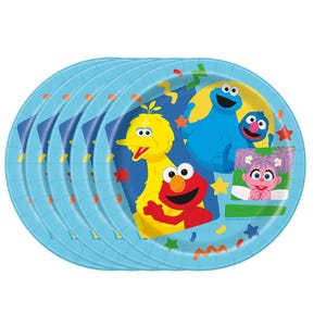 May include: A stack of round light blue paper plates featuring Sesame Street characters including Big Bird, Elmo, Cookie Monster, Grover, and Abby Cadabby. The design includes colorful confetti shapes like stars and squiggles against a dark blue background.