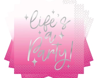 May include: Pink and white ombre napkins with the phrase "life's a party!" in silver script. The napkins have a decorative edge and silver star accents. Ideal for a birthday or celebration.