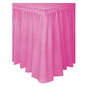 May include: A bright pink table skirt with a pleated top edge and a flowing, gathered design. The fabric drapes down, creating a full, decorative look. Ideal for parties and events.