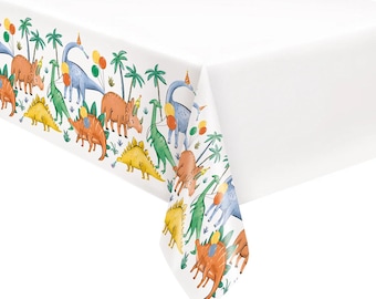 May include: White rectangular tablecloth with a colorful border featuring various dinosaurs, palm trees, and balloons. The dinosaurs are in shades of orange, yellow, green, and blue, with party hats. The tablecloth is suitable for a dinosaur-themed party.