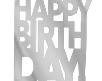 May include: A silver-colored, rectangular cake topper with the words "HAPPY BIRTHDAY!" cut out in a bold, sans-serif font. The topper has a textured surface and small pegs at the bottom for insertion into a cake. A festive decoration for birthday celebrations.