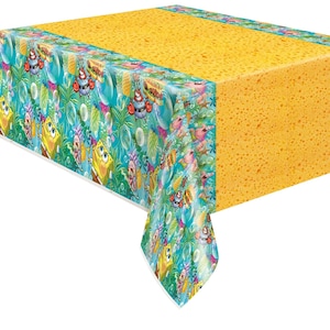 May include: A yellow and teal SpongeBob SquarePants themed tablecloth. The tablecloth features a yellow sponge-like texture on the top and a patterned border with SpongeBob, Patrick, and other characters. The border has a teal background with bubbles and tropical elements.