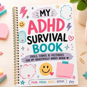 May include: A spiral-bound notebook with the title "MY ADHD SURVIVAL BOOK" in bright colours. The cover includes the text "TOOLS, CHAOS & VICTORIES FOR MY BEAUTIFULLY WIRED BRAIN" and "PLAN. FOCUS. RESET. REPEAT." Pink heart-shaped sticky notes and pens are also visible.