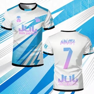 May include: A white short-sleeve t-shirt featuring blue diagonal stripes, a black crew neck, and black sleeve cuffs. The front displays the text JUL RIEN 100 RIEN with an alien graphic. The back shows the name NINETTA, the number 7, and JUL.