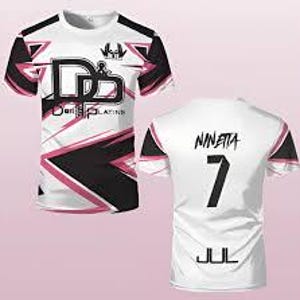 May include: A short-sleeved t-shirt featuring a white base with black and pink geometric patterns. The front displays the text "D&B" and "D&B PLATINS" with a small logo. The back shows the name "NINETTA", the number "7", and the text "JUL".