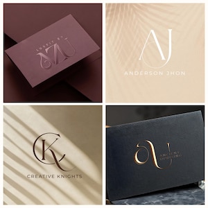 May include: A collection of business cards featuring elegant logo designs. The cards showcase various color schemes, including burgundy, beige, and navy, with embossed or gold foil lettering. The logos incorporate initials and company names.