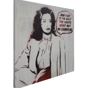 May include: A canvas wall art piece featuring a stencil-style portrait of a person with dark hair wearing a collared shirt with a bow. The image includes a speech bubble with the text: ...AND THAT... IS THE NIGHT THE LIGHTS WENT OUT IN GEORGIA!