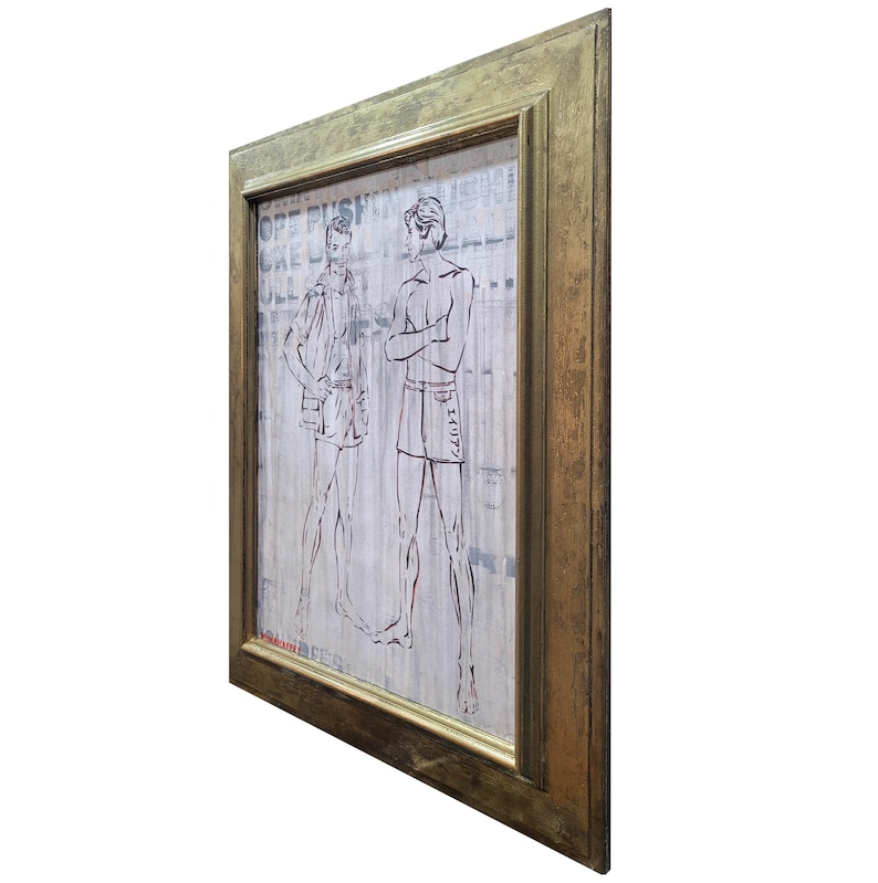 May include: A framed artwork featuring a black and white illustration of two men in swim trunks. The artwork is set against a background of printed text.