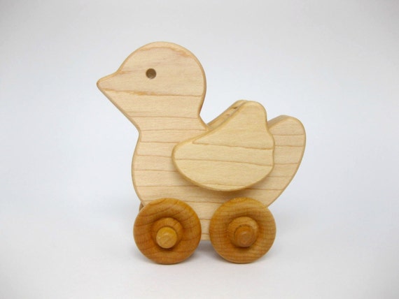wooden toy duck on wheels