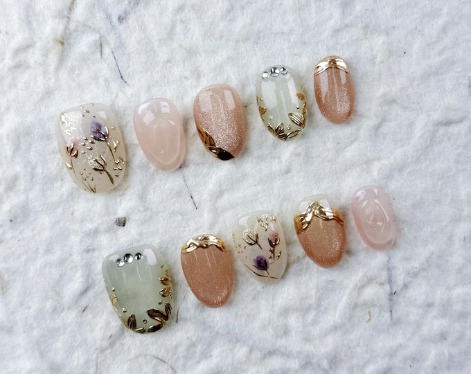 Short Oval Press On Nails in Soft Pink & Beige. Golden Leaves, Purple Flowers, Subtle Shimmer, Perfect for Daily Commute and Elegant Dates