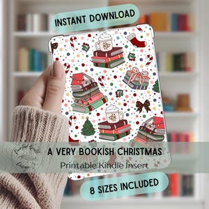 May include: A Very Bookish Christmas Kindle insert with a festive design. The insert features stacks of books, mugs of cocoa, candy canes, Christmas trees, and gift boxes. The words "Instant Download" and "8 Sizes Included" are also visible.