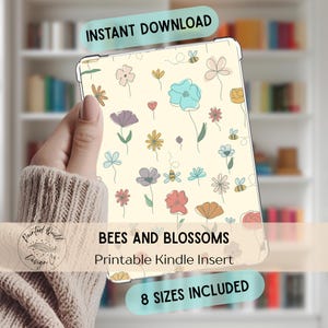 May include: A Kindle insert featuring a floral pattern with bees and blossoms in various colors on a cream background. The text "INSTANT DOWNLOAD", "BEES AND BLOSSOMS", "Printable Kindle Insert", and "8 SIZES INCLUDED" are visible.