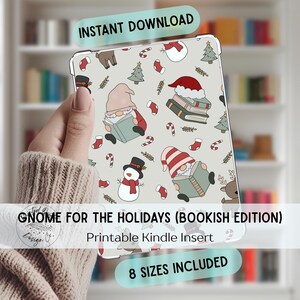 May include: A light gray Kindle insert with a festive pattern featuring gnomes, snowmen, Christmas trees, and candy canes. The text "GNOME FOR THE HOLIDAYS (BOOKISH EDITION)" is displayed. The words "INSTANT DOWNLOAD" and "8 SIZES INCLUDED" are also visible.