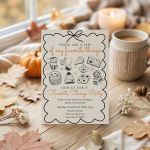 May include: A rectangular party invitation card with a scalloped black border. The text reads: THESE ARE A FEW of my favourite things, JOIN US FOR A Favourite Things Party, Bring 3 of the same items wrapped, valued at around $30, Saturday | October 10, 2026 | 3pm, Phoebe's House, 123 Your Street Ave, Your City, ST 12345. Illustrations include a basket of apples, a beanie, slippers, a scarf, a teapot, a book, and a slice of pie.