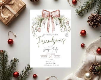 May include: A Friendsmas invitation with a blush pink bow and festive greenery. The invitation includes the text "TIS THE SEASON FOR Friendsmas" and details for the event, including the date, time, and RSVP information. The image is decorated with Christmas ornaments and pinecones.