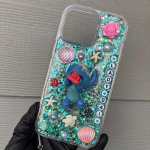 May include: A set of three ceramic nesting bowls in shades of blue, green, and white. The bowls feature a speckled glaze and a simple, modern design. The largest bowl measures approximately 6 inches in diameter.