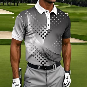 May include: A short-sleeved polo shirt with a white collar and a three-button placket. The shirt features a gray and black abstract design with a dotted pattern. The person is wearing gray trousers and a black belt.