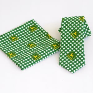 May include: Green and white gingham patterned tie and pocket square with a yellow John Deere logo.