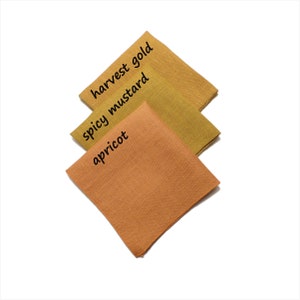 May include: Three fabric swatches in shades of orange and yellow. The swatches are labeled "apricot", "spicy mustard", and "harvest gold".